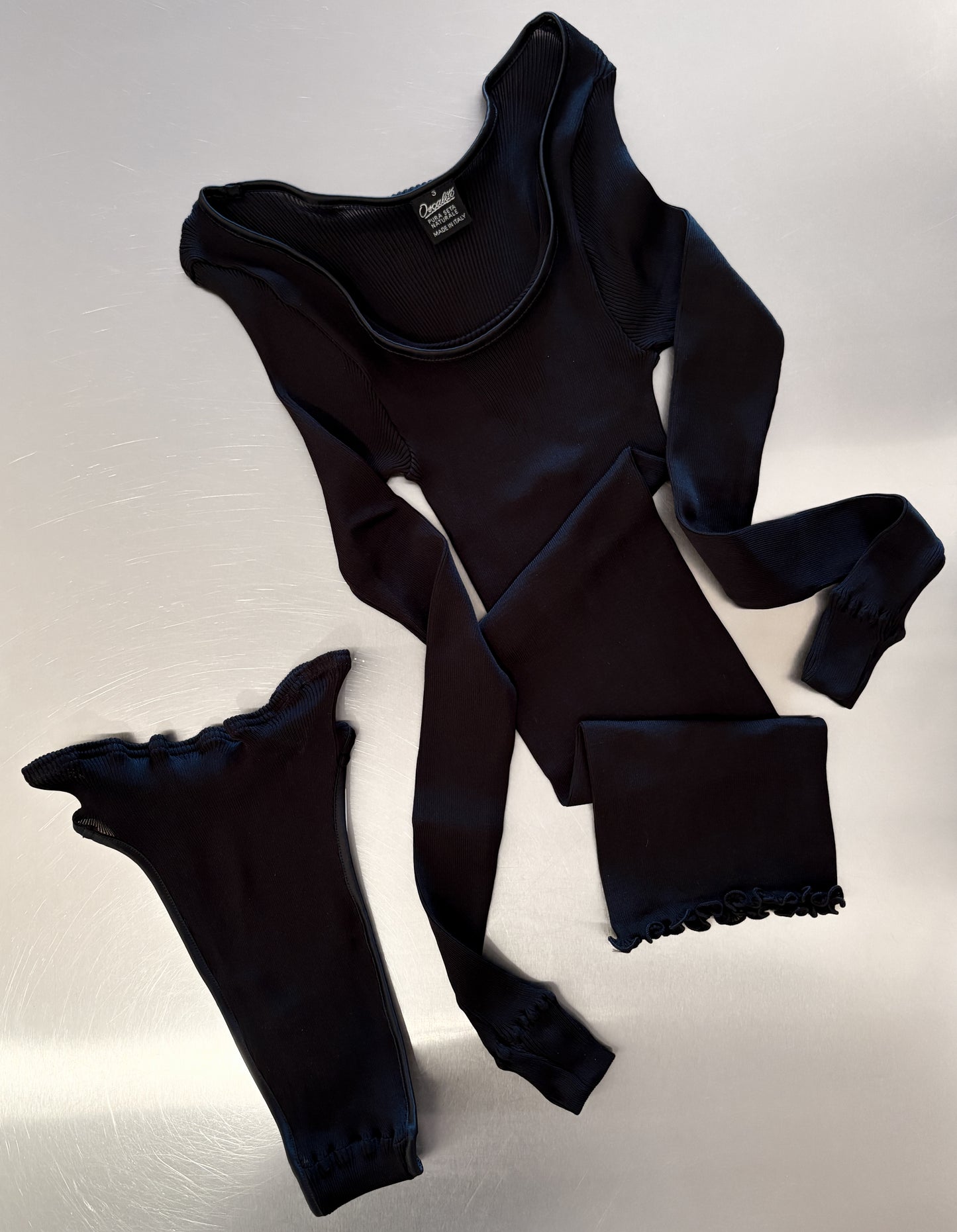 Black long-sleeve shirt and underwear set on a white background