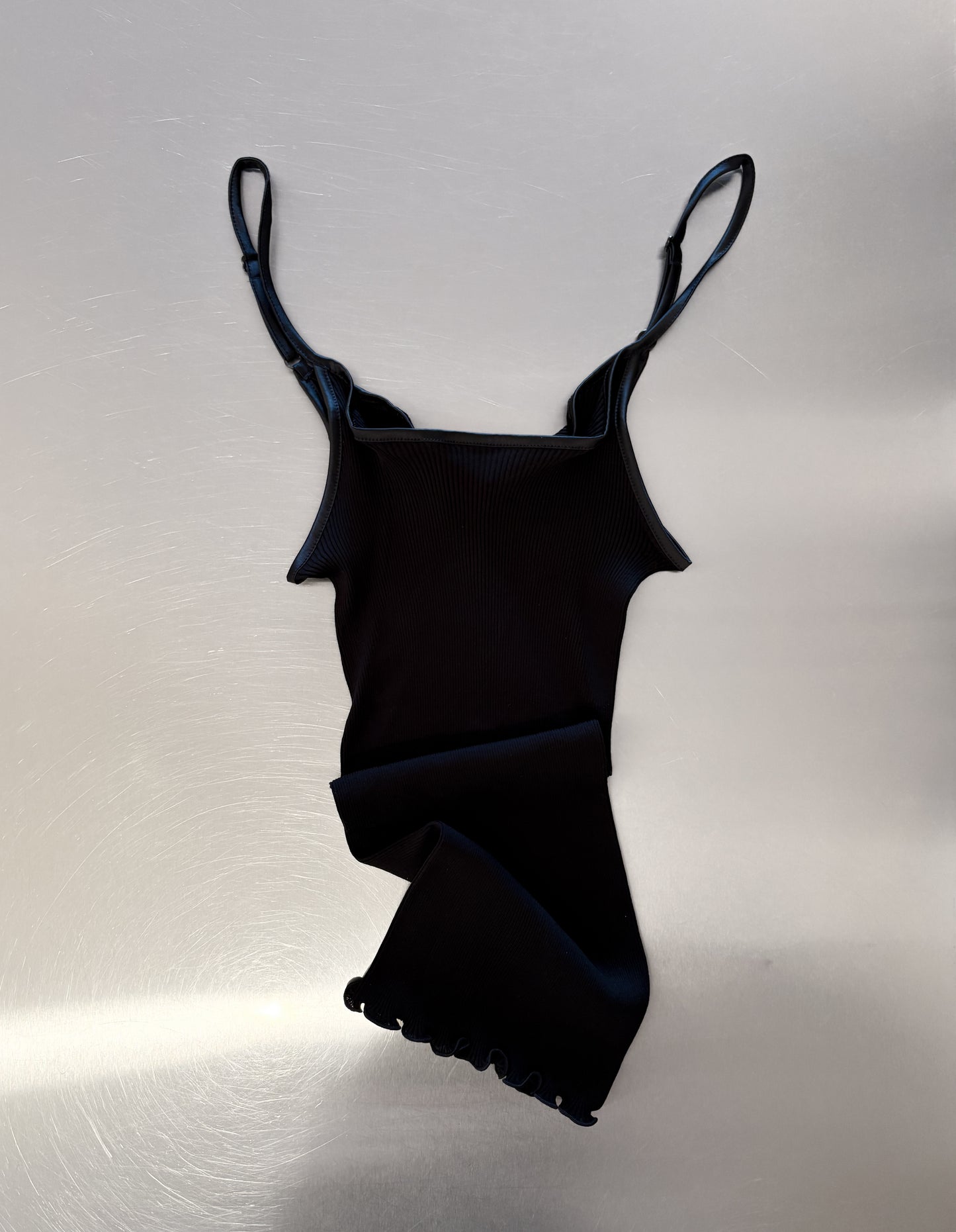 Black singlet on table