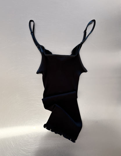 Black singlet on table