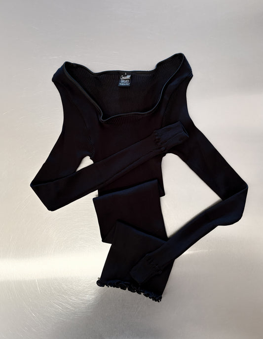 Silk Black Long Sleeve on a table