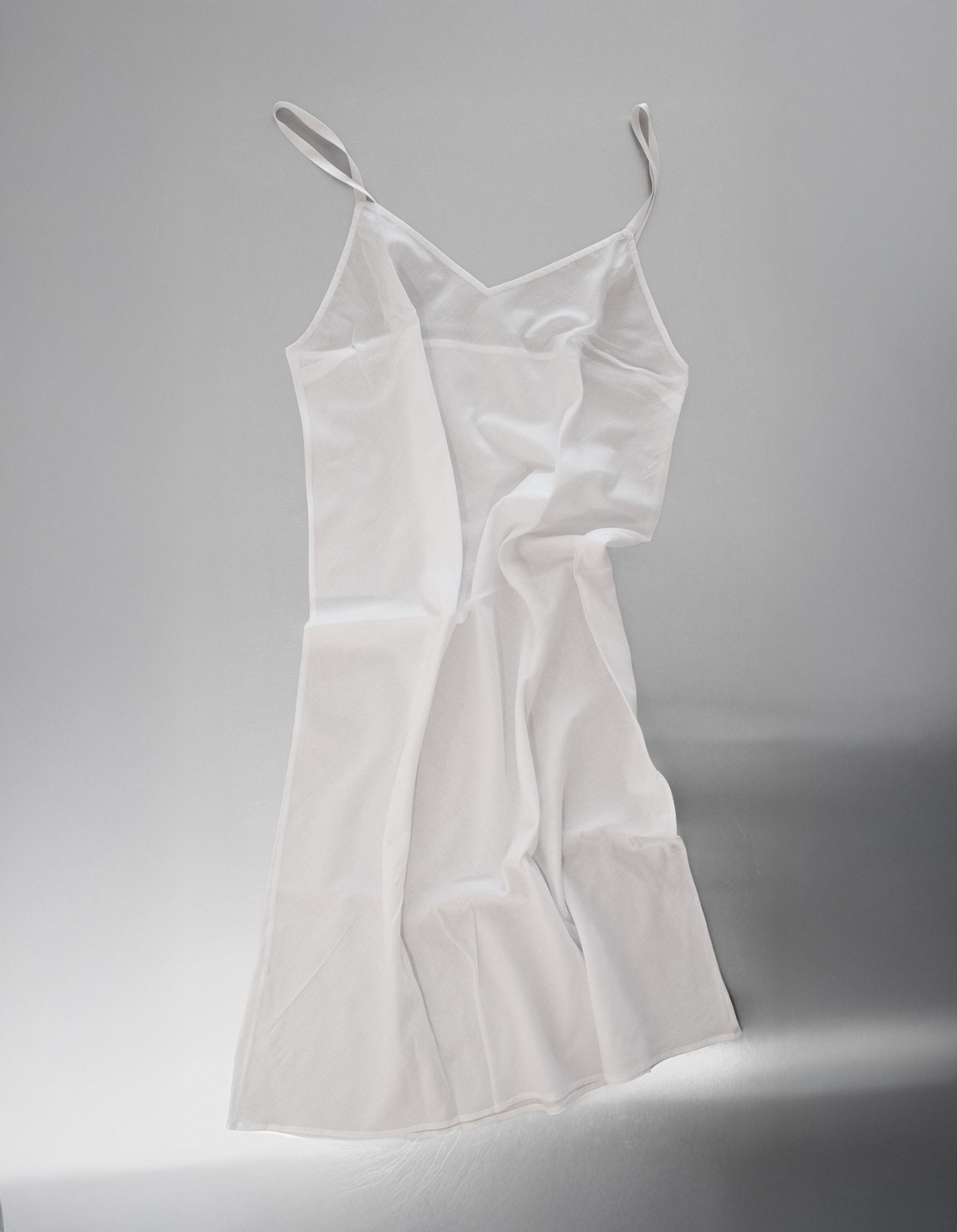 White slip dress on a white background