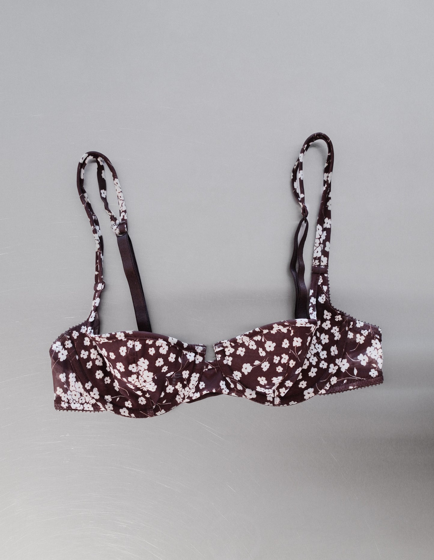 Floral-patterned bra on a gray background